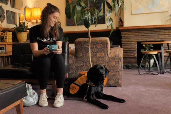 lady and guide dog in training in a hotel