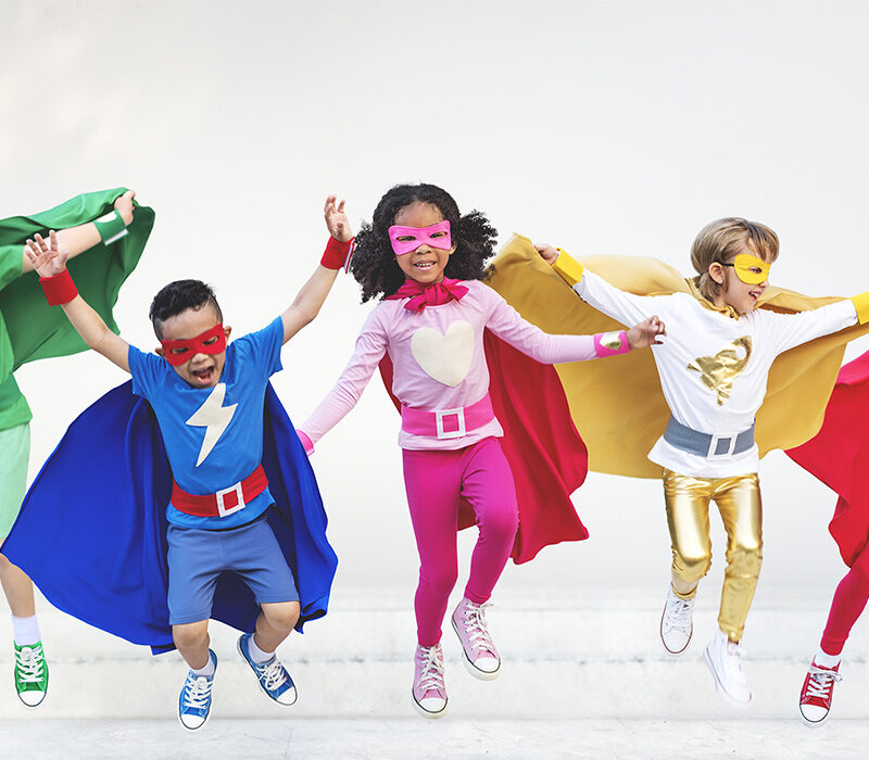 children dressed up in superhero costumes