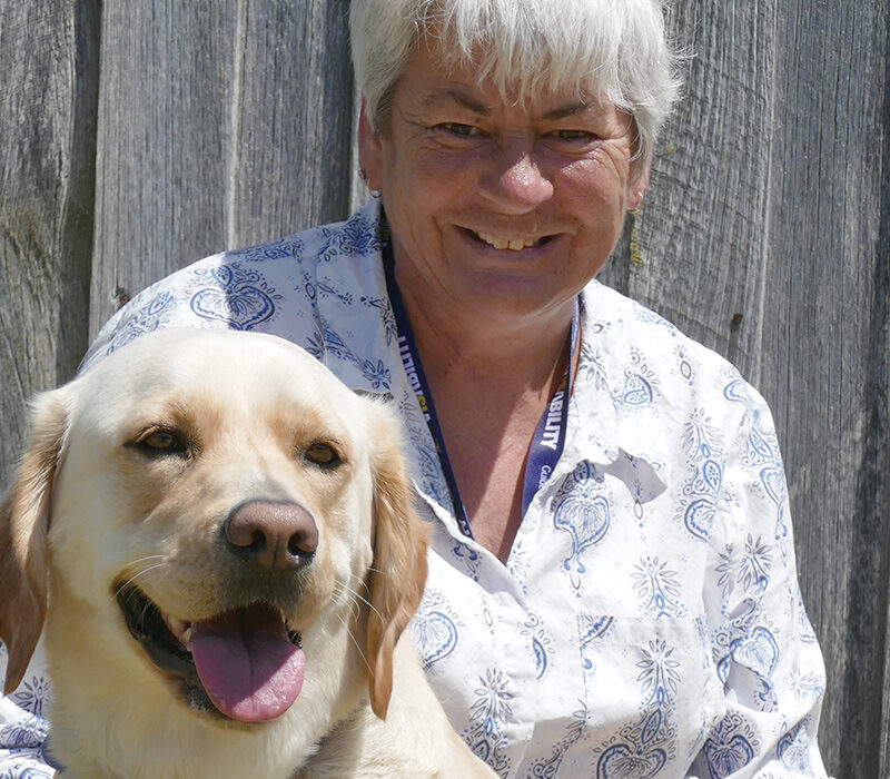 smiling lady with Guide Dog