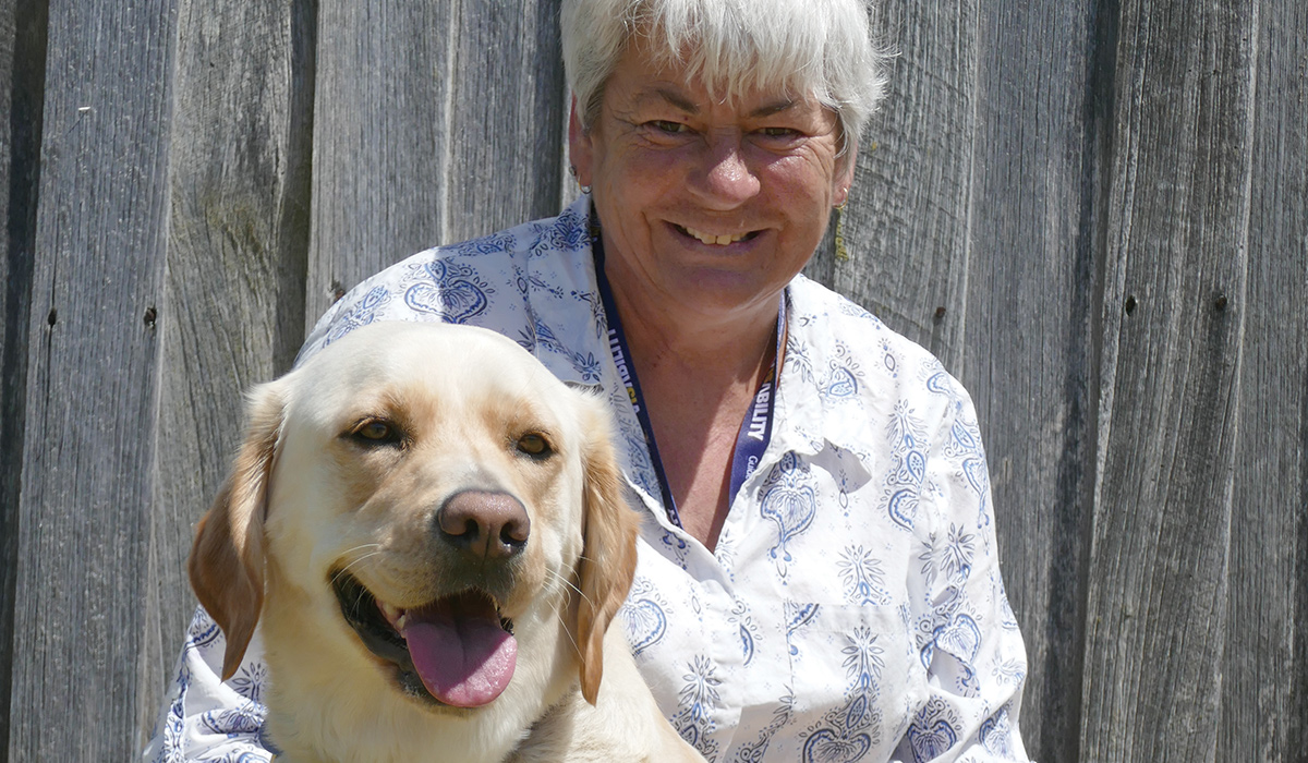 smiling lady with Guide Dog